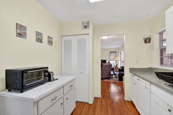 a kitchen with wooden cabinets and a stove top oven