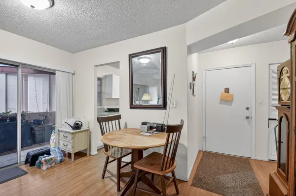 a view of a livingroom with furniture and a window