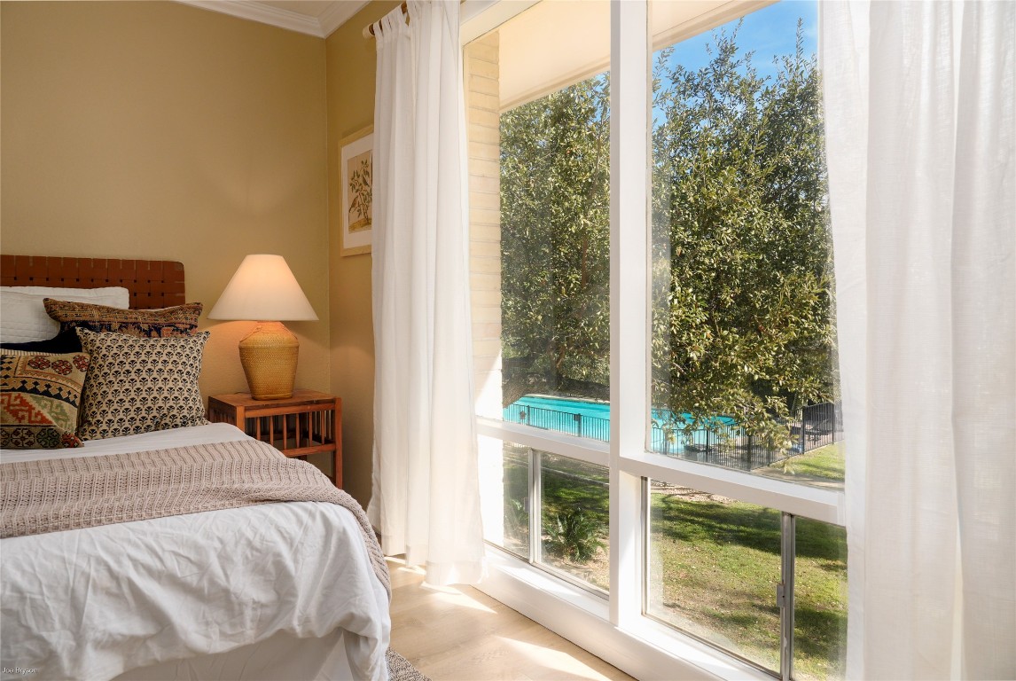 5326 Balcones Drive, Unit D Austin, TX 78731 - Photo 12 of 28 a bedroom with a bed and a window