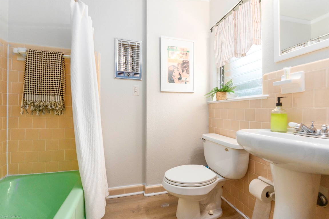 5326 Balcones Drive, Unit D Austin, TX 78731 - Photo 16 of 28 a bathroom with a sink and a mirror