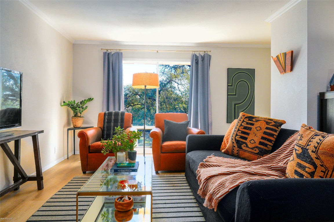 5326 Balcones Drive, Unit D Austin, TX 78731 - Photo 17 of 28 a living room with furniture and a large window