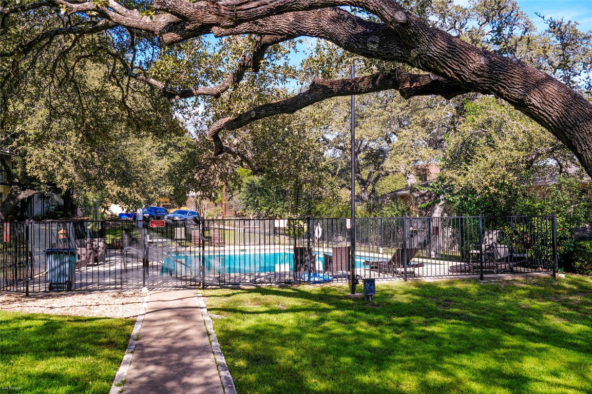 5326 Balcones Drive, Unit D Austin, TX 78731 - Photo 23 of 28 a view of a park with swings and slides