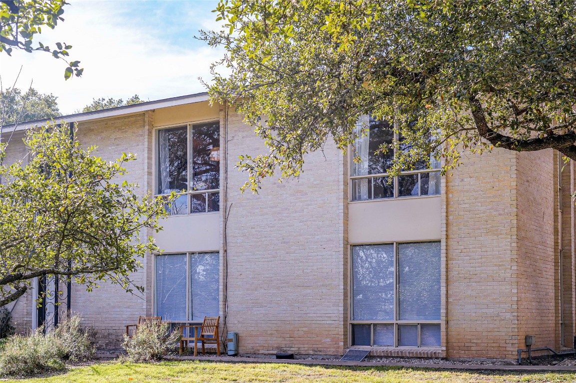 5326 Balcones Drive, Unit D Austin, TX 78731 - Photo 26 of 28 a view of a house with a yard