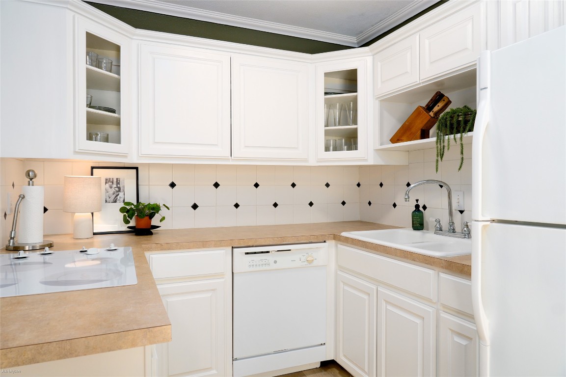 5326 Balcones Drive, Unit D Austin, TX 78731 - Photo 4 of 28 a kitchen with stainless steel appliances white cabinets and a window