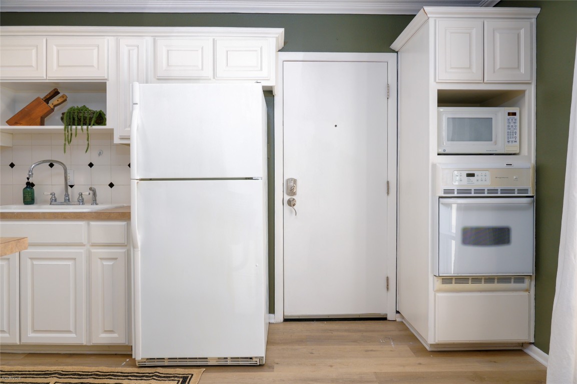 5326 Balcones Drive, Unit D Austin, TX 78731 - Photo 7 of 28 a white refrigerator freezer sitting in a kitchen