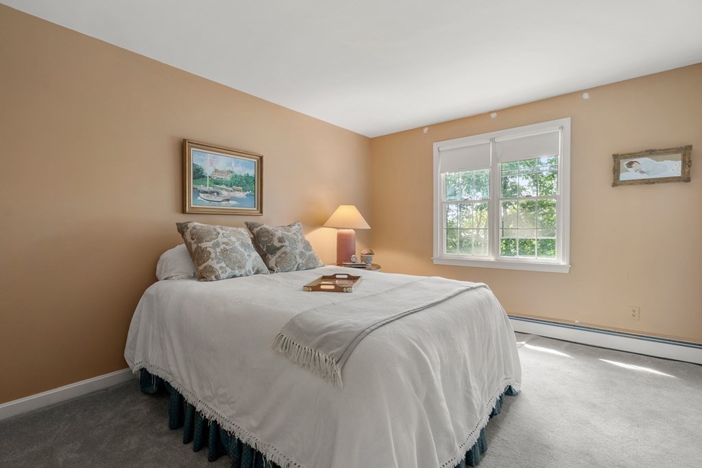 16 Carlton Road Marblehead, MA 01945 - Photo 23 of 42 a bedroom with a bed and a window