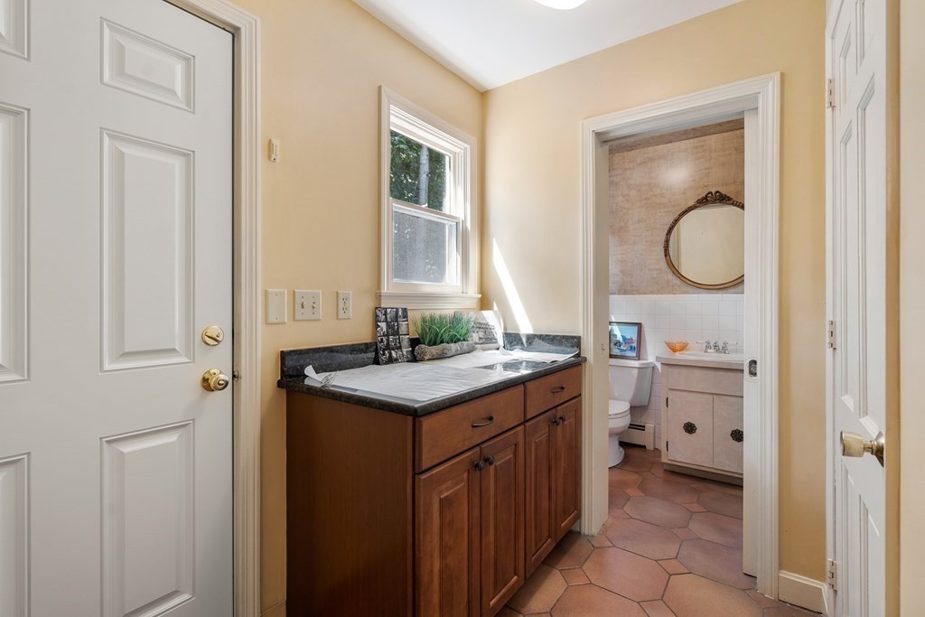 16 Carlton Road Marblehead, MA 01945 - Photo 30 of 42 a bathroom with a sink a toilet and a mirror