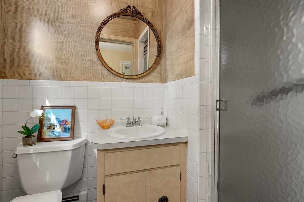 16 Carlton Road Marblehead, MA 01945 - Photo 31 of 42 a bathroom with a sink and a mirror