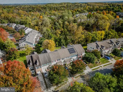 an aerial view of a pool yard swimming pool and outdoor seating