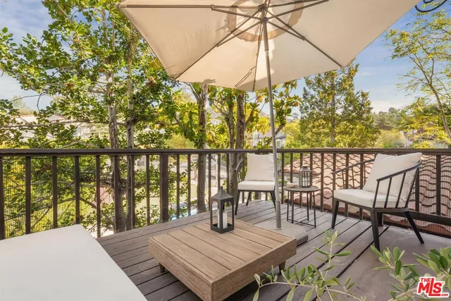 a view of a livingroom with furniture window and wooden floor