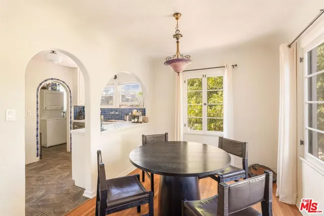 a kitchen with sink stove and cabinets