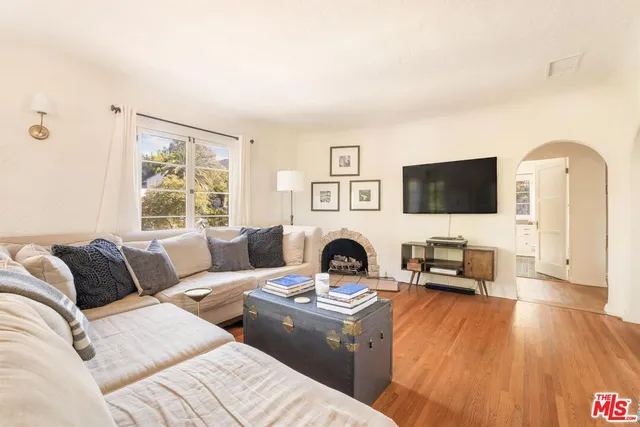 a spacious bedroom with a large bed and a window