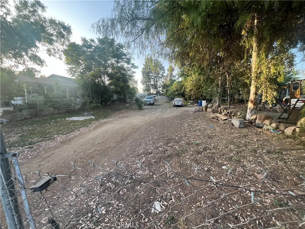 21580 Lane Perris Ca Perris, CA 92570 - Photo 3 of 6 a view of a yard with a tree