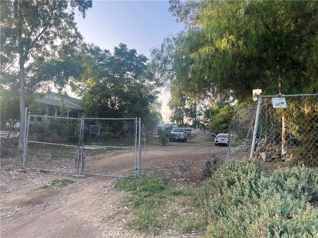 21580 Lane Perris Ca Perris, CA 92570 - Photo 4 of 6 a backyard of a house with lots of green space