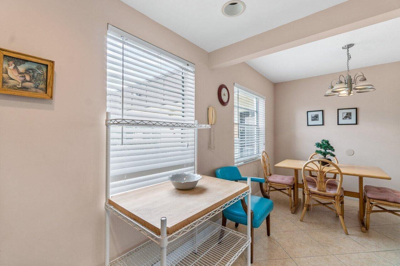715 Normandy Lane Delray Beach, FL 33484 - Photo 6 of 43 a view of a workspace with furniture and a window