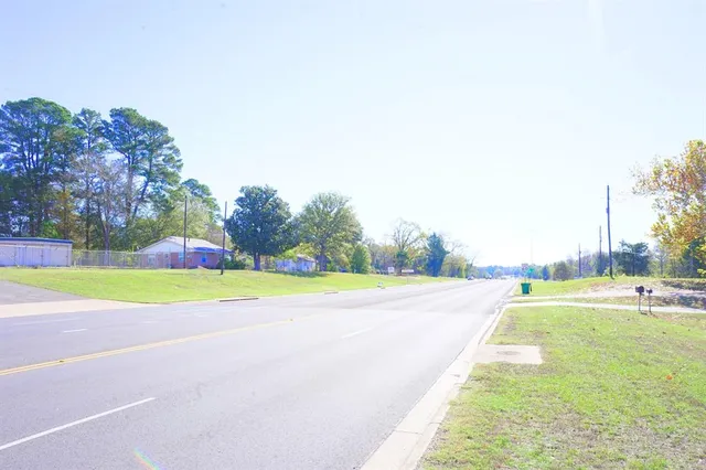an aerial view of a residential houses with outdoor space