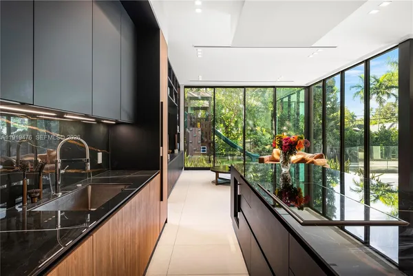 a view of a living room and a floor to ceiling window
