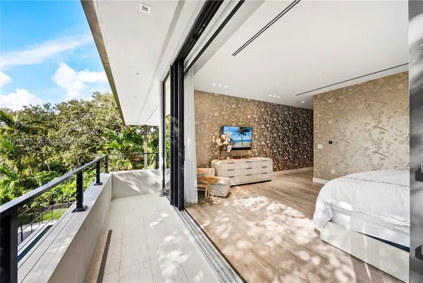 a large spacious bathroom with a tub double vanity and window