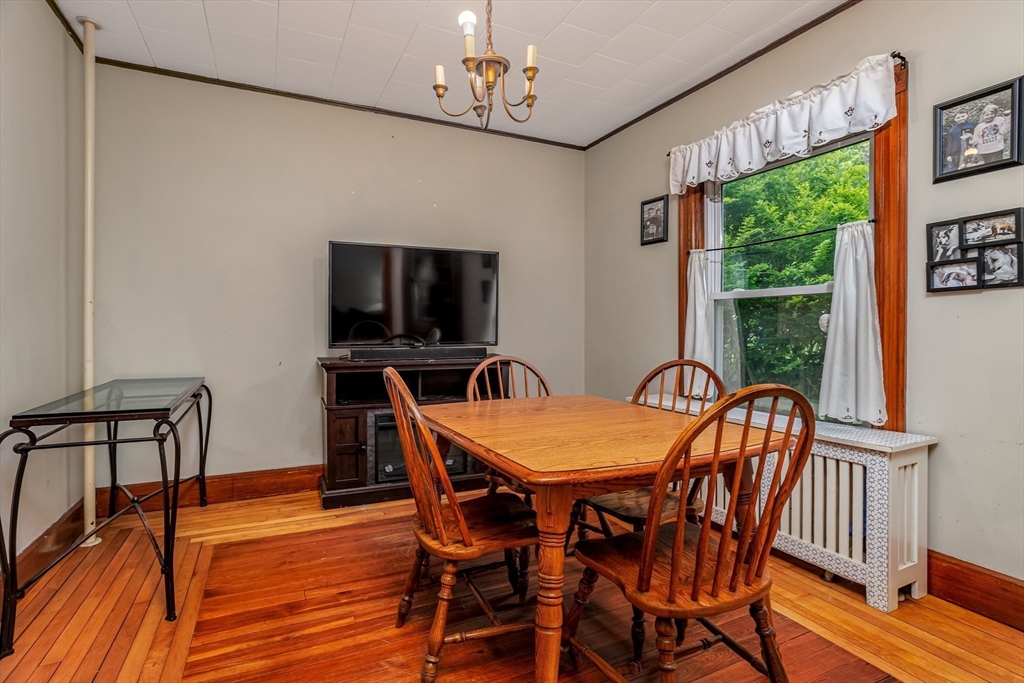 54 Charles Street Gardner, MA 01440 - Photo 15 of 40 a dining room with furniture a window and wooden floor