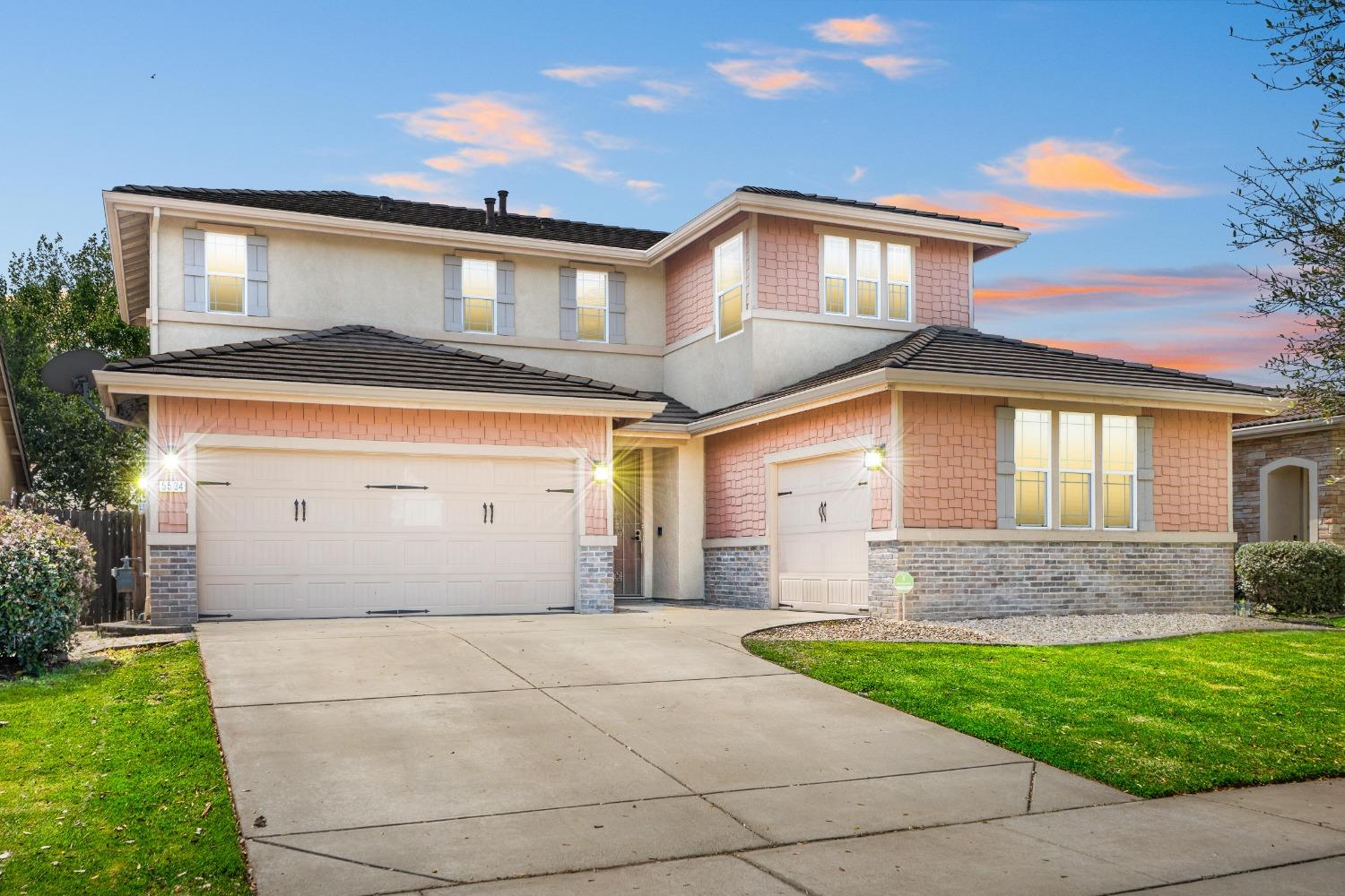 5534 Trailhead Loop Marysville, CA 95901 - Photo 1 of 1 a front view of a house with a yard and garage