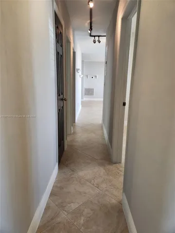 a bed room with a bed and a chair