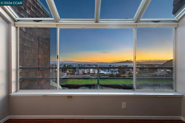 a view of a balcony with an ocean view