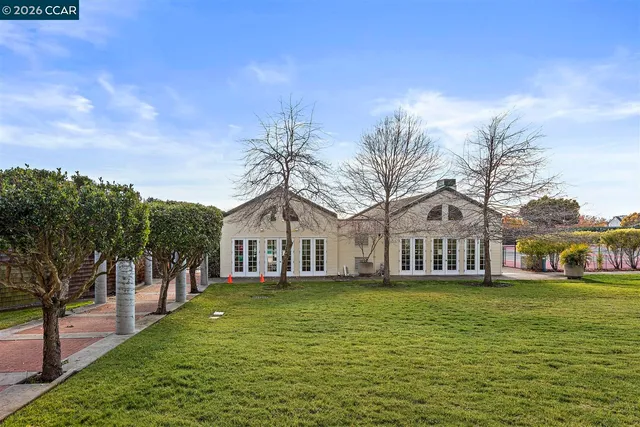 a view of a swimming pool with a patio