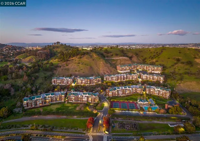 a view of a terrace with lawn chairs