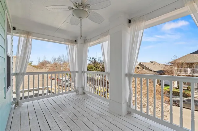 a view of a porch with wooden floor and outdoor space
