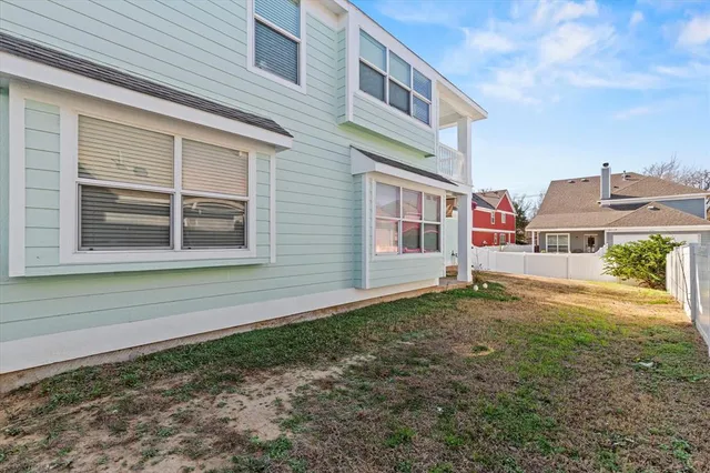 a house view with a backyard space