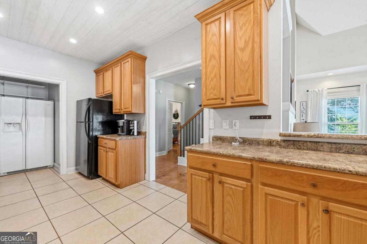 172 Mays Road Milledgeville, GA 31061 - Photo 21 of 54 a kitchen with stainless steel appliances granite countertop a refrigerator and a sink
