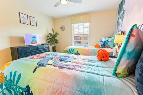 a bedroom with a bed and dresser