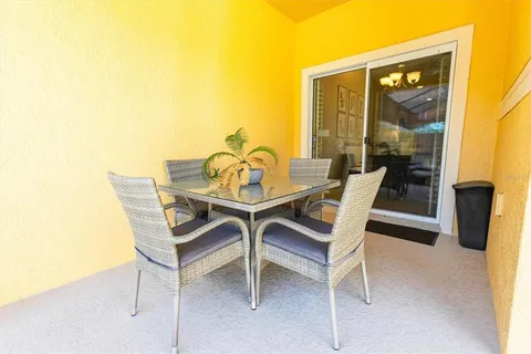 a dining room with furniture and a window