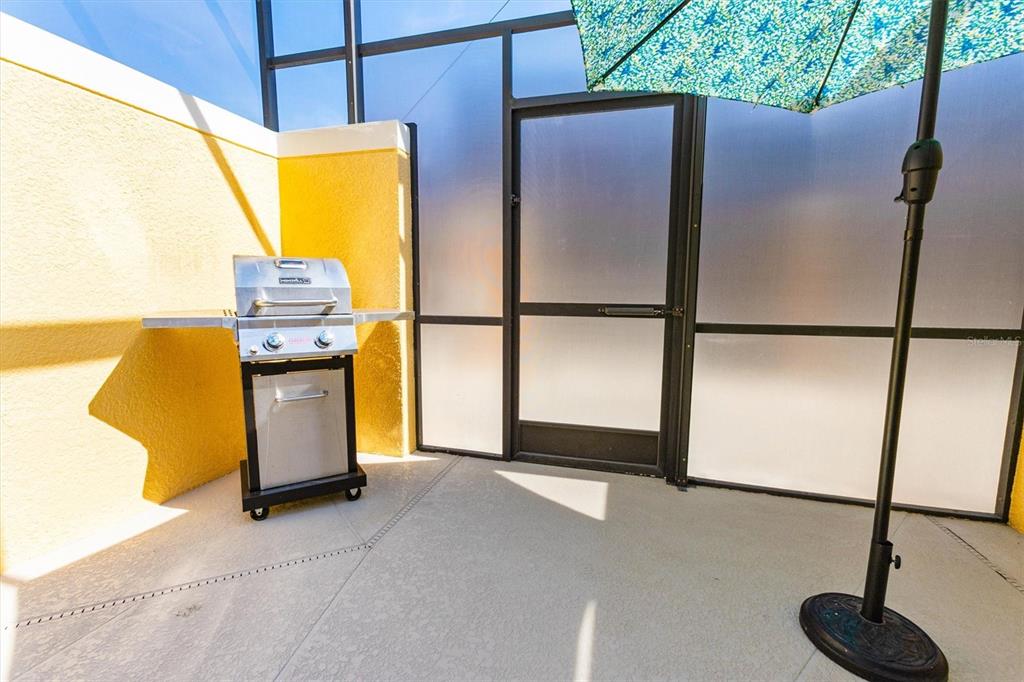 8955 California Palm Road Kissimmee, FL 34747 - Photo 23 of 44 a kitchen with a refrigerator and a sink