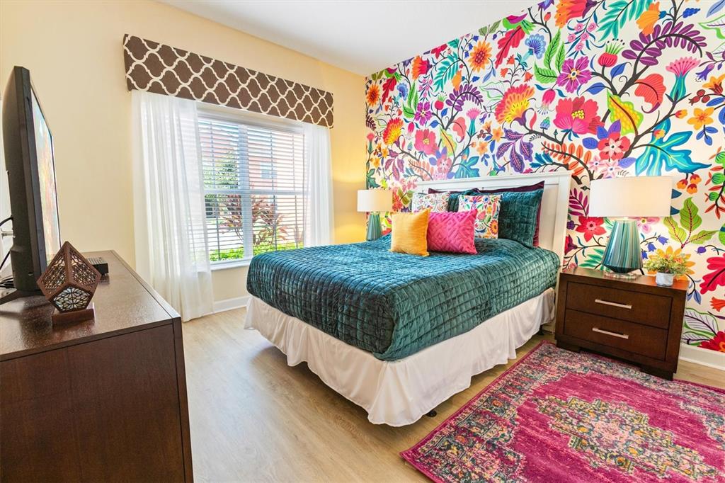 8955 California Palm Road Kissimmee, FL 34747 - Photo 8 of 44 a bedroom with a bed dresser and a window