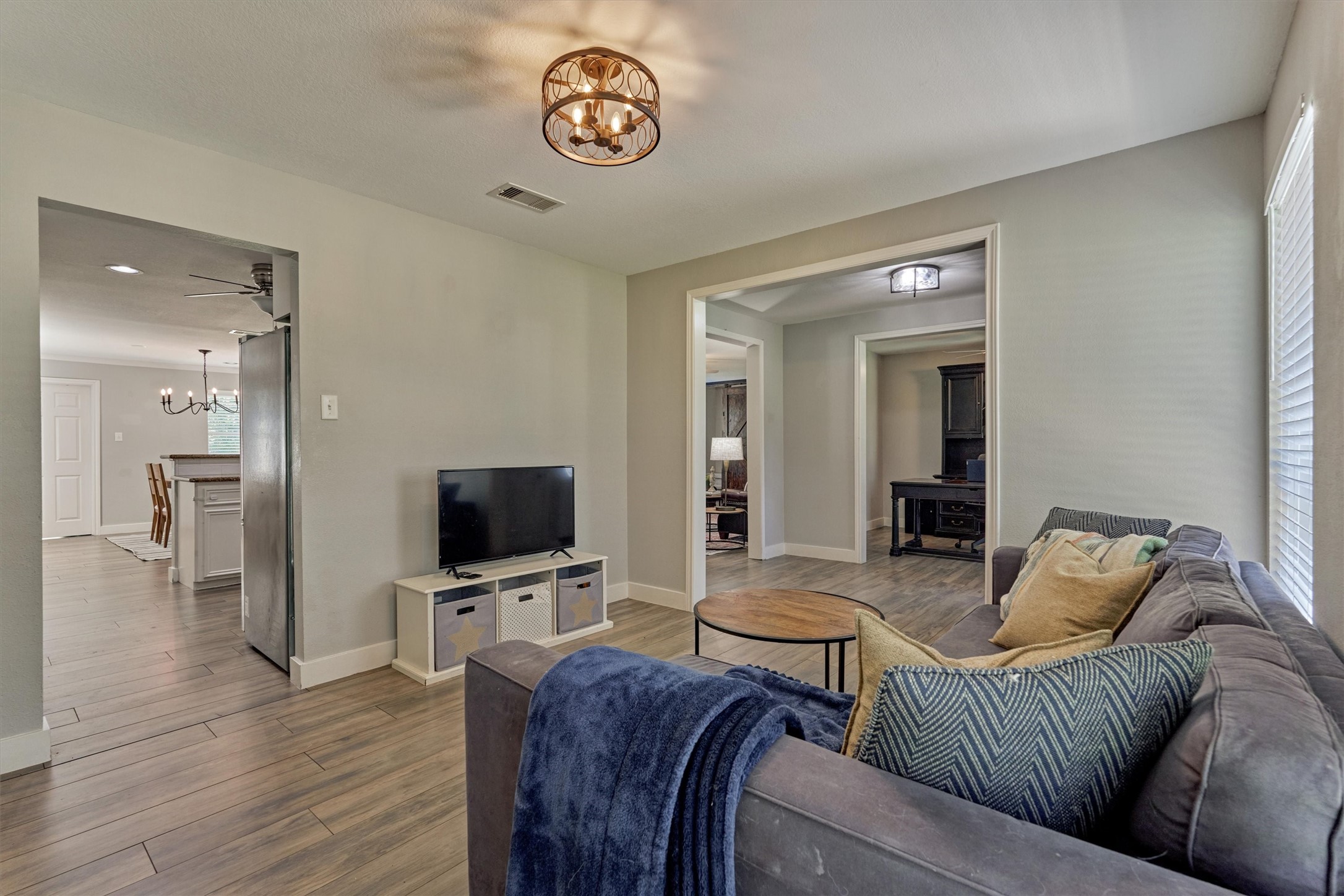 6515 Glenhill Drive Spring, TX 77389 - Photo 8 of 39 a living room with furniture and a flat screen tv