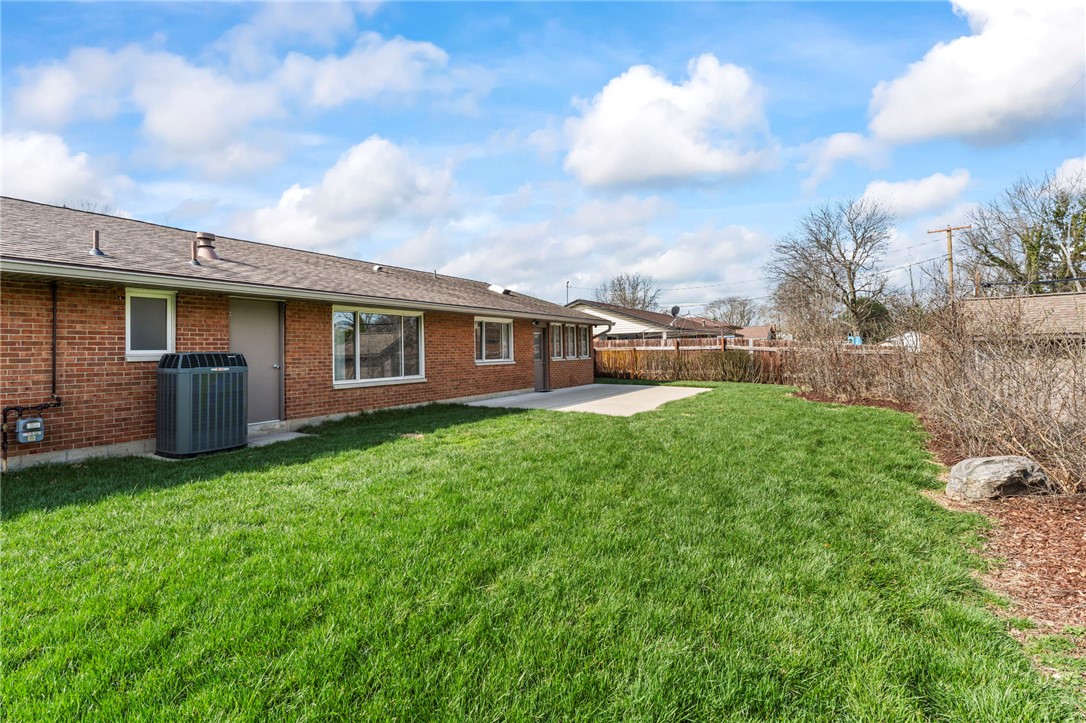 2247 East Whipp Road Dayton, OH 45440 - Photo 51 of 52 This spacious backyard offers ample green space and a private patio for outdoor enjoyment.