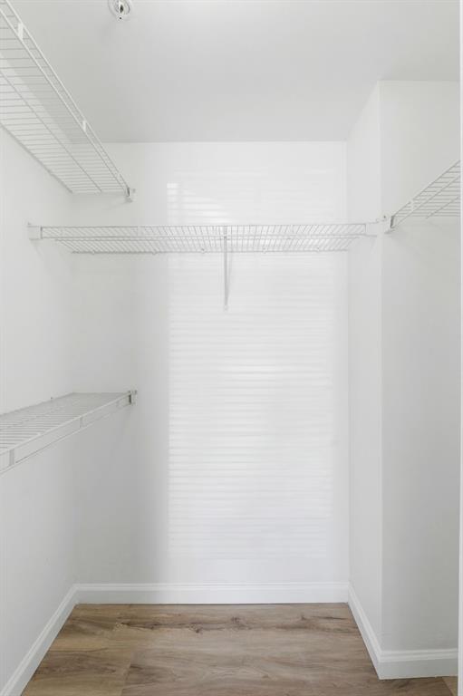 5800 West Sample Road, Unit 102 Coral Springs, FL 33067 - Photo 15 of 23 a view of a room with racks on the wall