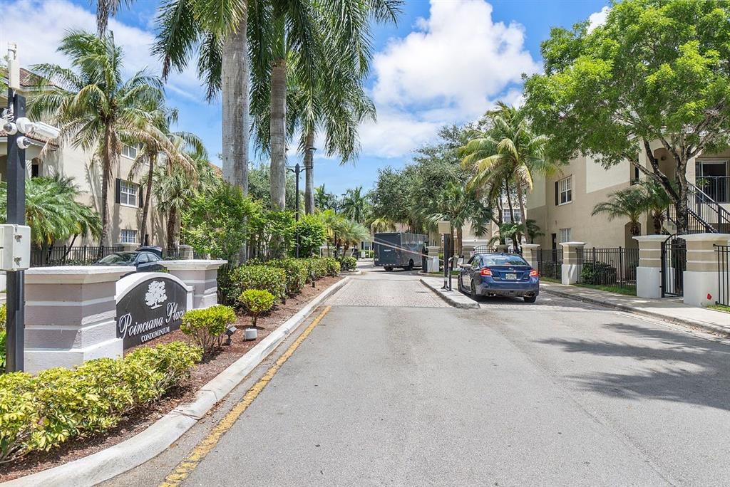 5800 West Sample Road, Unit 102 Coral Springs, FL 33067 - Photo 22 of 23 a view of a street with a cars parked