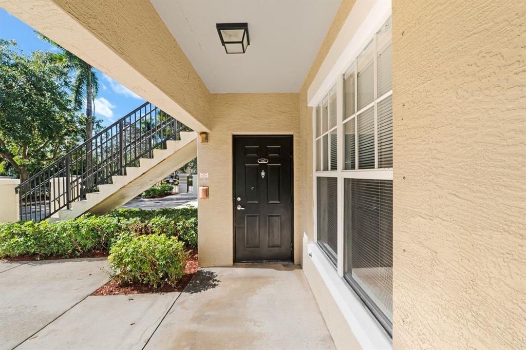 5800 West Sample Road, Unit 102 Coral Springs, FL 33067 - Photo 4 of 23 a entryway view with a outdoor space