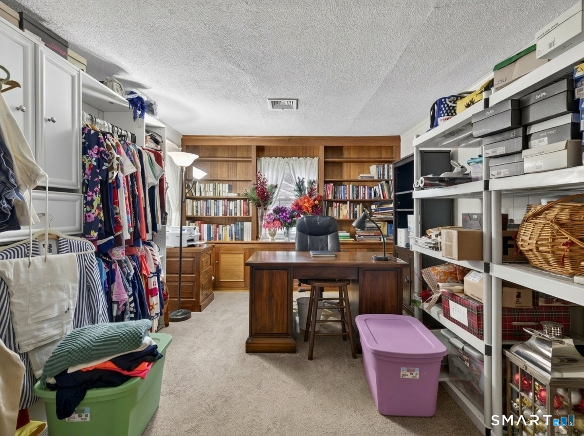 235 Scotland Road Norwich, CT 06360 - Photo 19 of 31 a view of walk in closet with clothes and shoes