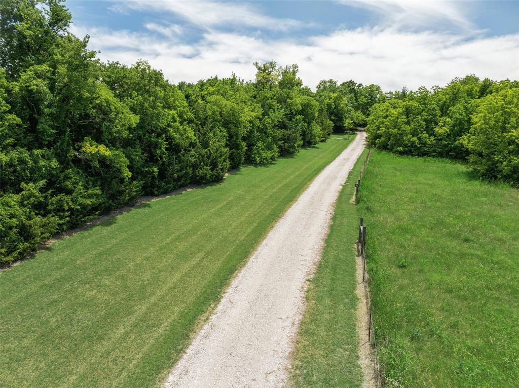 1000 Ballard Road Van Alstyne, TX 75495 - Photo 5 of 40 a view of a lake with a big yard