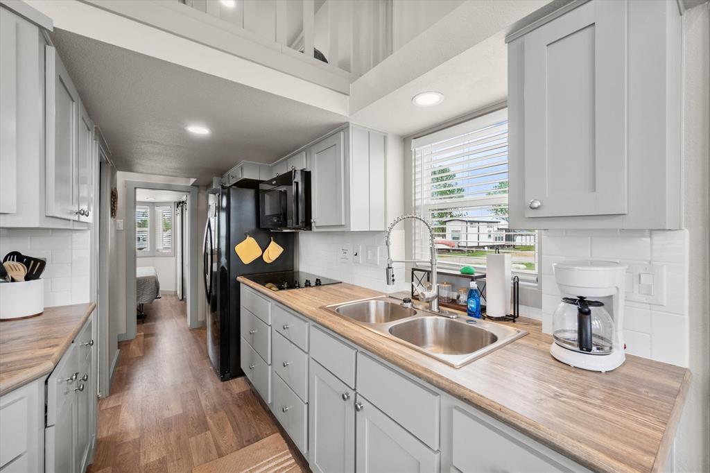 6388 Peninsula Road Kerens, TX 75144 - Photo 11 of 38 a kitchen that has a sink and cabinets
