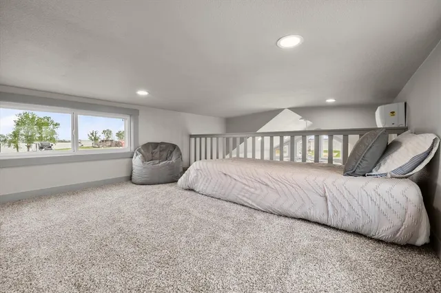 a bedroom with a bed and a couch