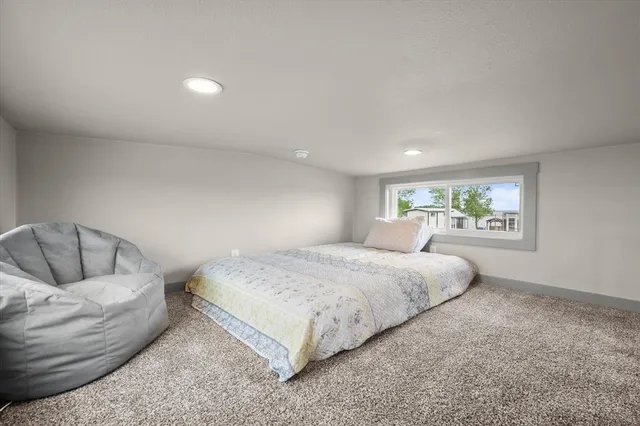 a bed room with a bed and a couch