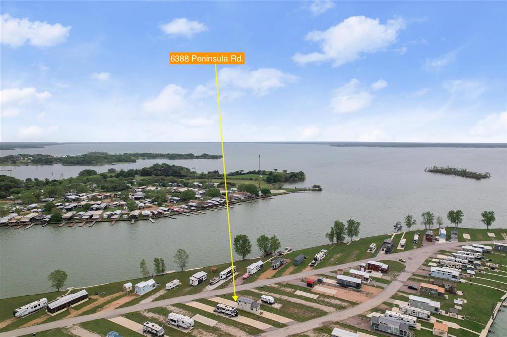 6388 Peninsula Road Kerens, TX 75144 - Photo 28 of 38 a picture of city view with lake view and boat