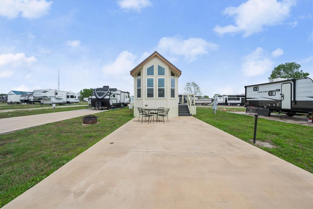 6388 Peninsula Road Kerens, TX 75144 - Photo 29 of 38 a front view of a house with garden
