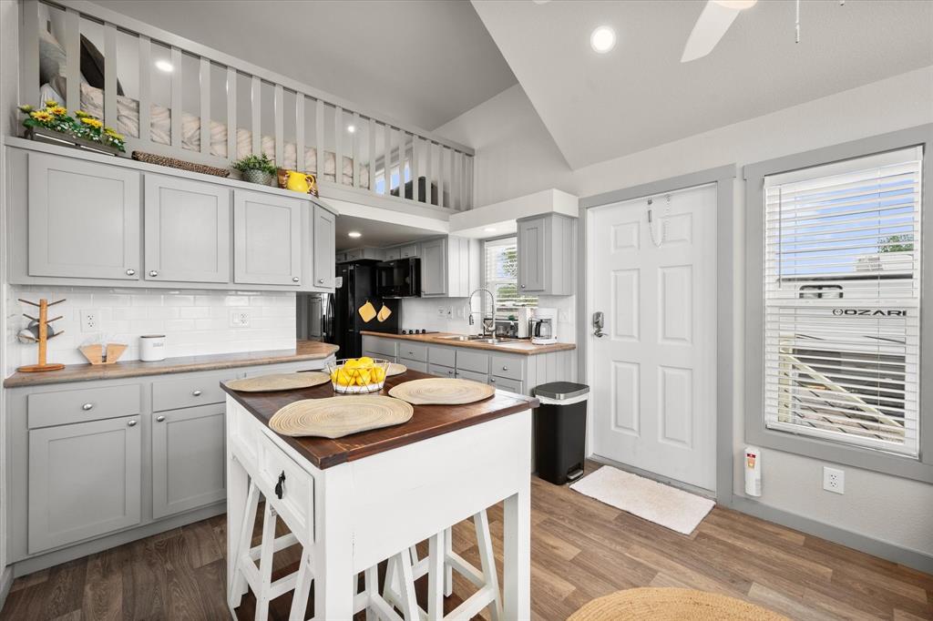 6388 Peninsula Road Kerens, TX 75144 - Photo 8 of 38 a kitchen with stainless steel appliances granite countertop a sink and cabinets
