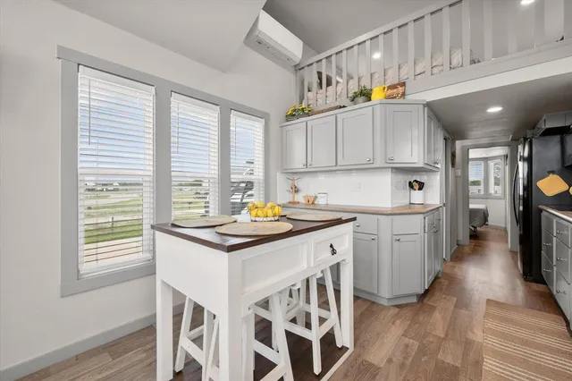 a kitchen that has a sink and cabinets