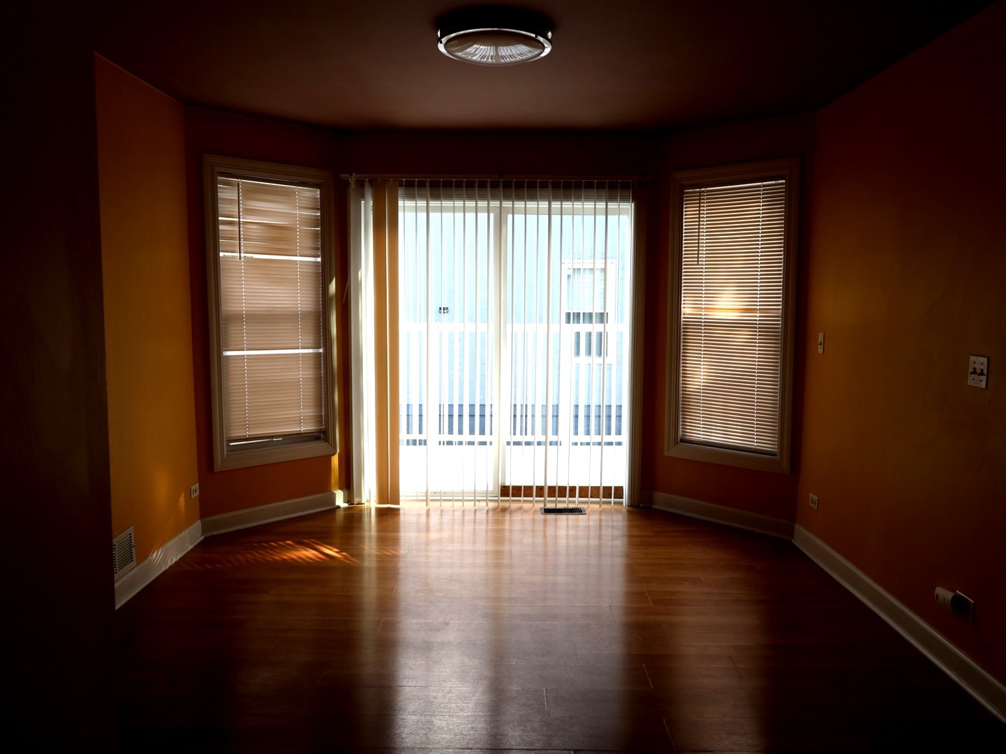 2911 Emmaus Avenue Zion, IL 60099 - Photo 13 of 28 a view of an empty room with wooden floor and a window